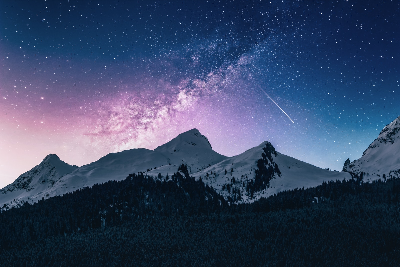 Photo by Benjamin Voros snow mountain under stars