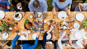 photo of people gathered around a table for dinner