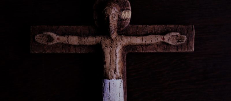 brown wooden cross with white cross